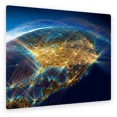 Aerial view of North America at night, illuminated with a network of glowing lines representing data connections and communication networks across the continent.